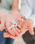House keys in a couples' hands